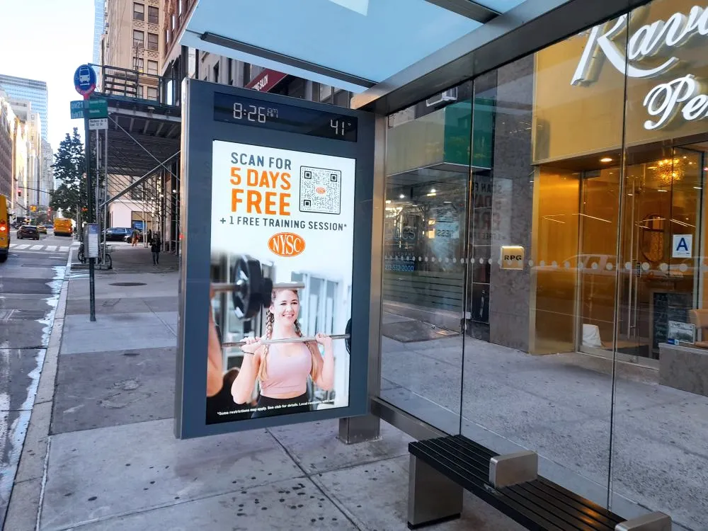 Bus shelter digital ad: scan for 5 days free plus a free training session